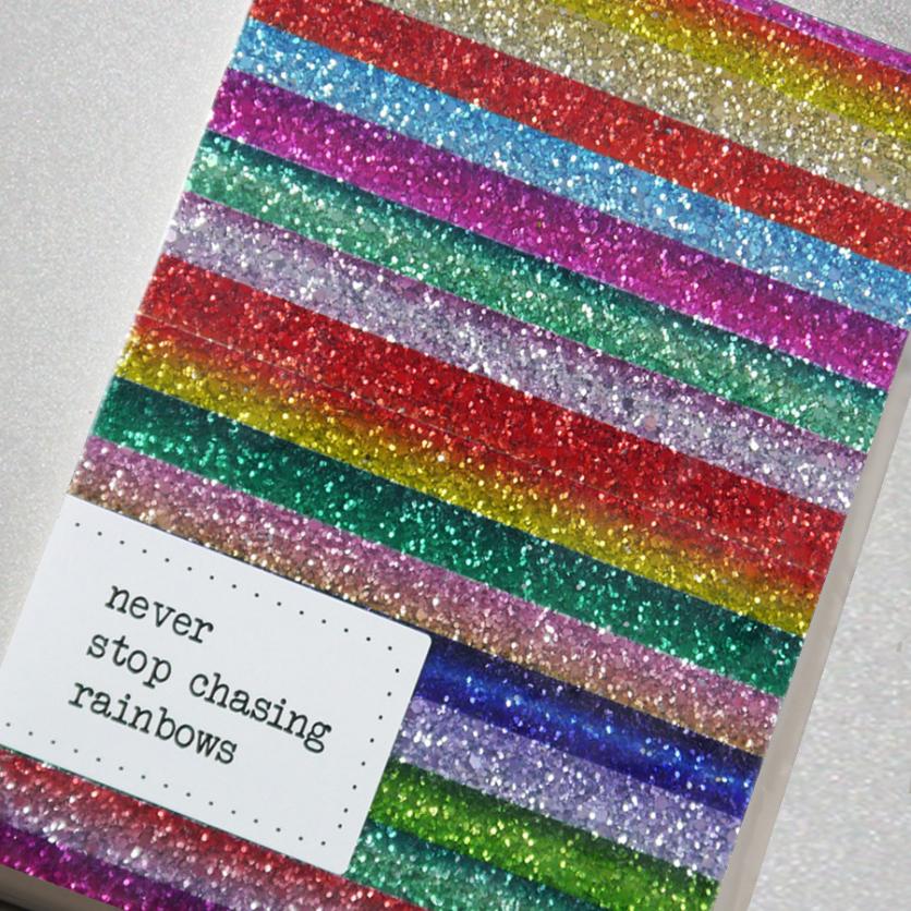 This perfectly sparkly notebook is handmade from glitter fabric featuring a beautiful multicolour rainbow stripe design.