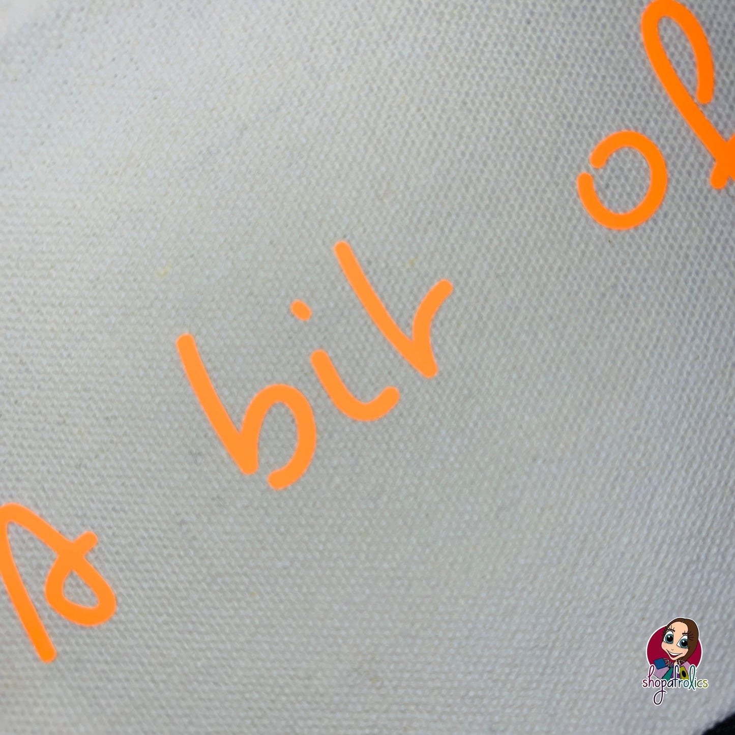 Close up of neon lettering of make up bag