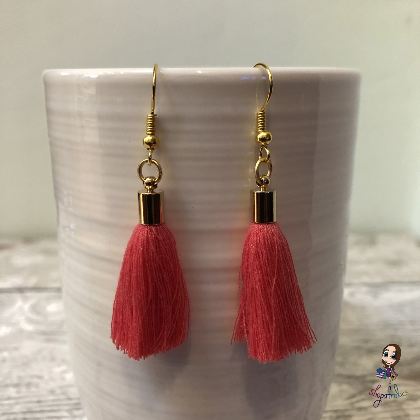Coral Cotton Tassel Earring with gold plated ear hooks, and findings.