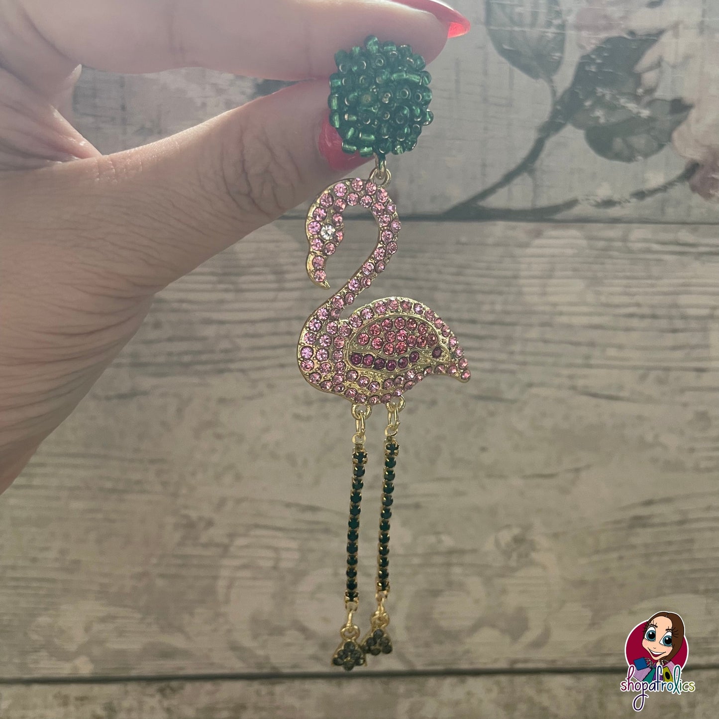 Close up pink crystal flamingo earrings