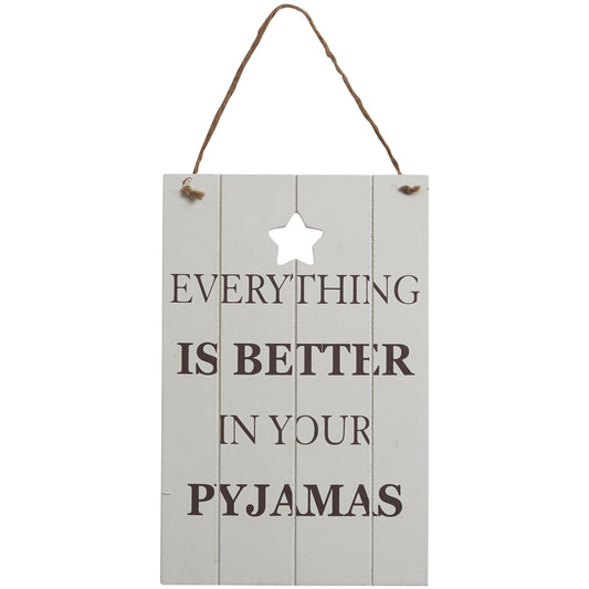 Wooden sign with a vintage chic look and featuring the slogan: Everything is Better in your Pyjamas.