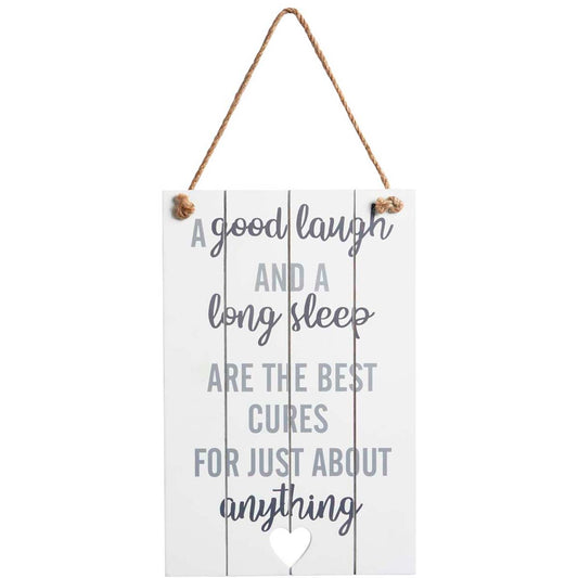 Wooden sign with slogan: A good laugh and a long sleep are the best cures for just about everything.
