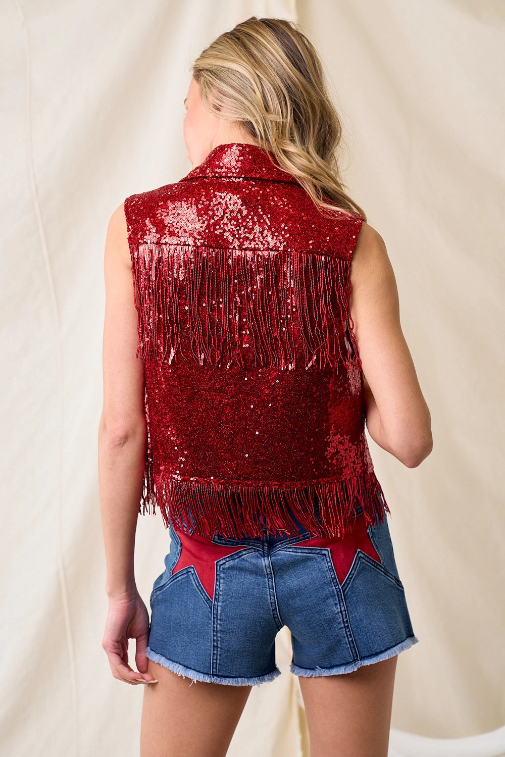 Back of Sequin embellished red fringe waistcoat