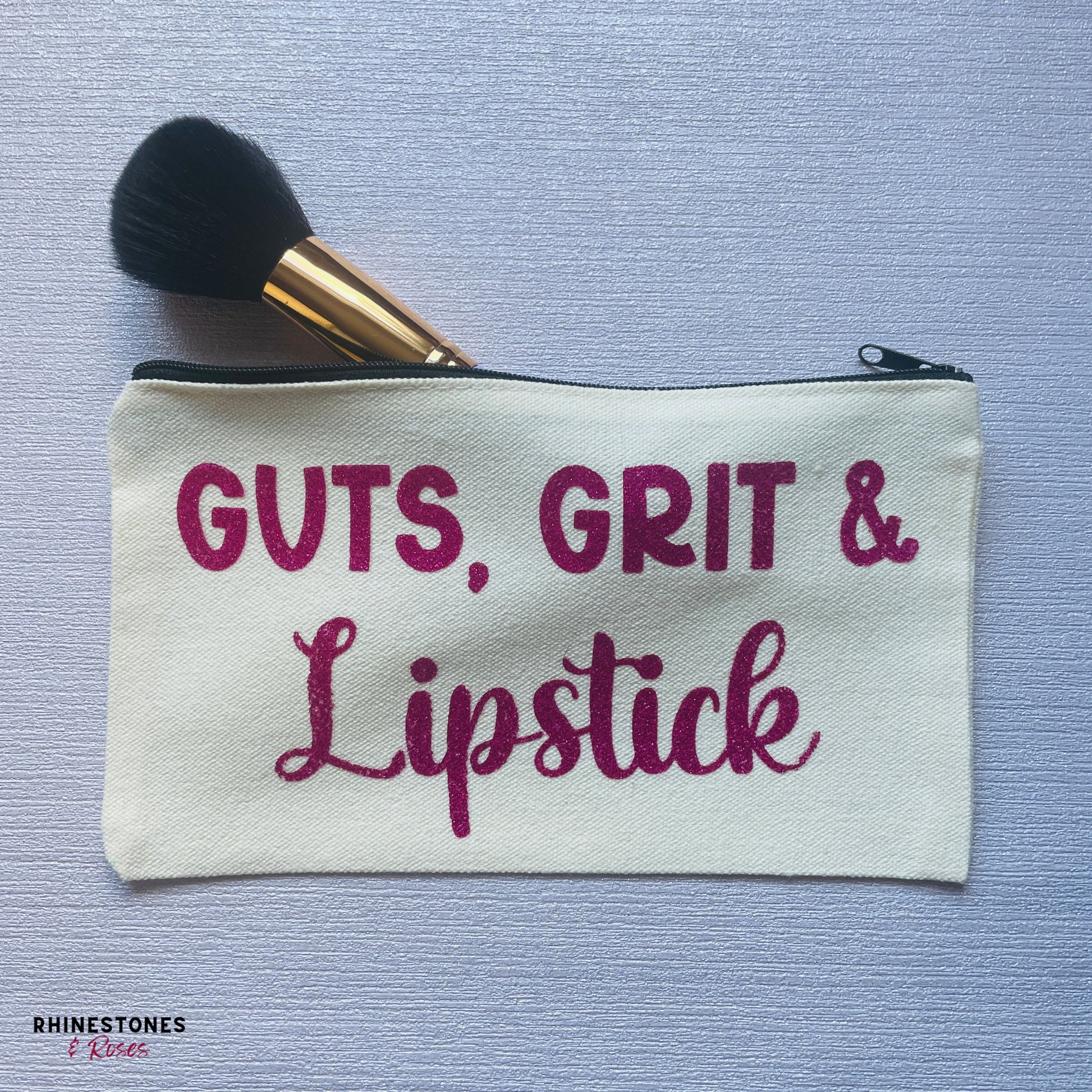 Motivational cosmetic bag featuring the phrase Guts, Grit and Lipstick