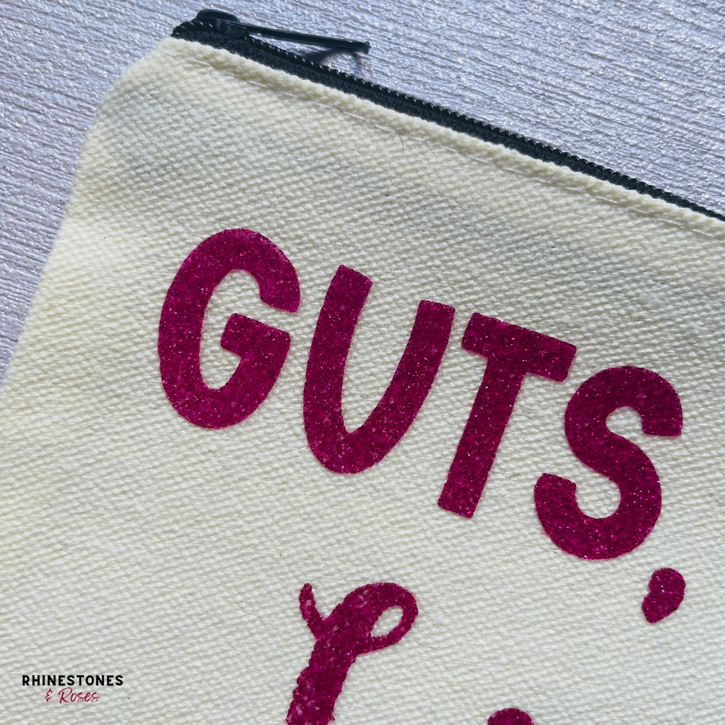 Close up of Guts, Grit and Lipstick make up bag