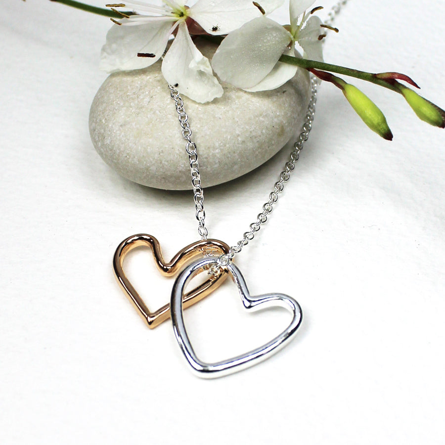 Pretty delicate necklace featuring 2 open hearts