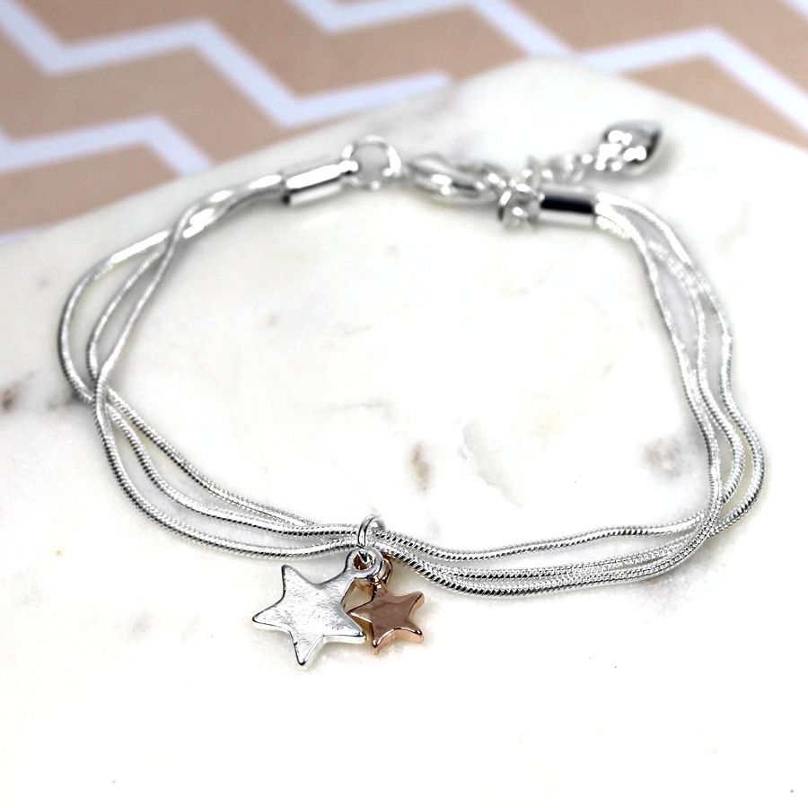 Silver plated triple chain bracelet with a silver plated star and a rose gold plated star