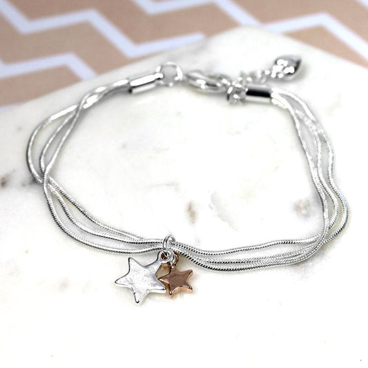 Silver plated triple chain bracelet with a silver plated star and a rose gold plated star