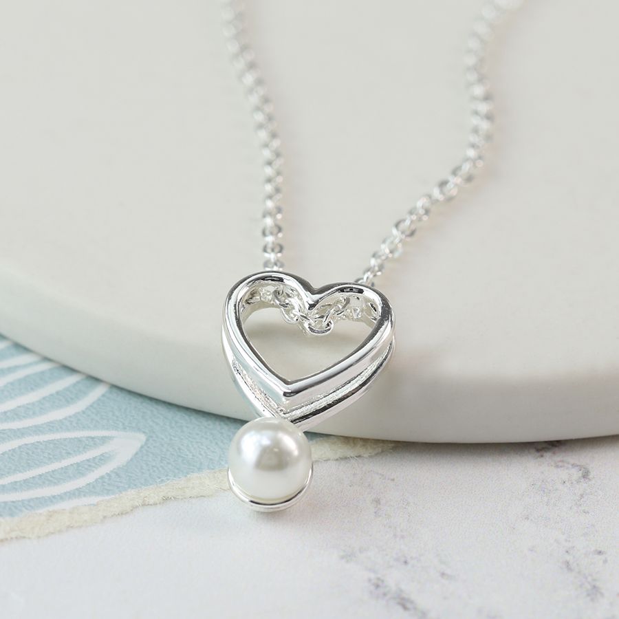Fine chain silver plated necklace with a double layer open heart and a single white faux pearl