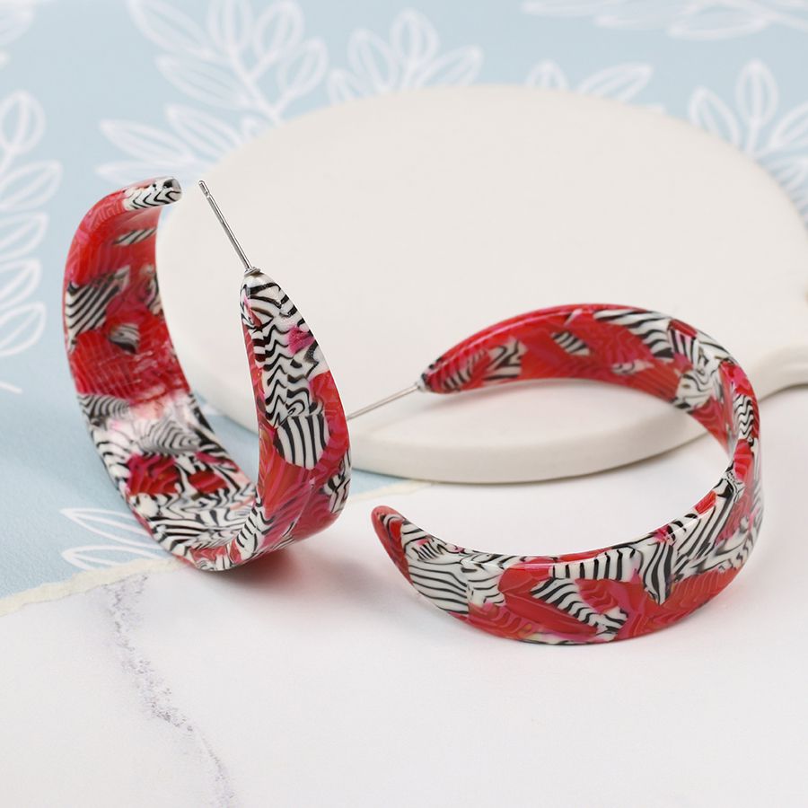 Gorgeous acrylic lightweight open hoop earrings in a red and zebra stripe design