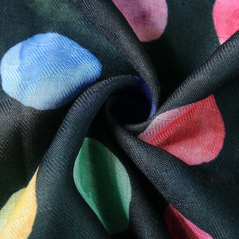 Close up of colours dots on black scarf
