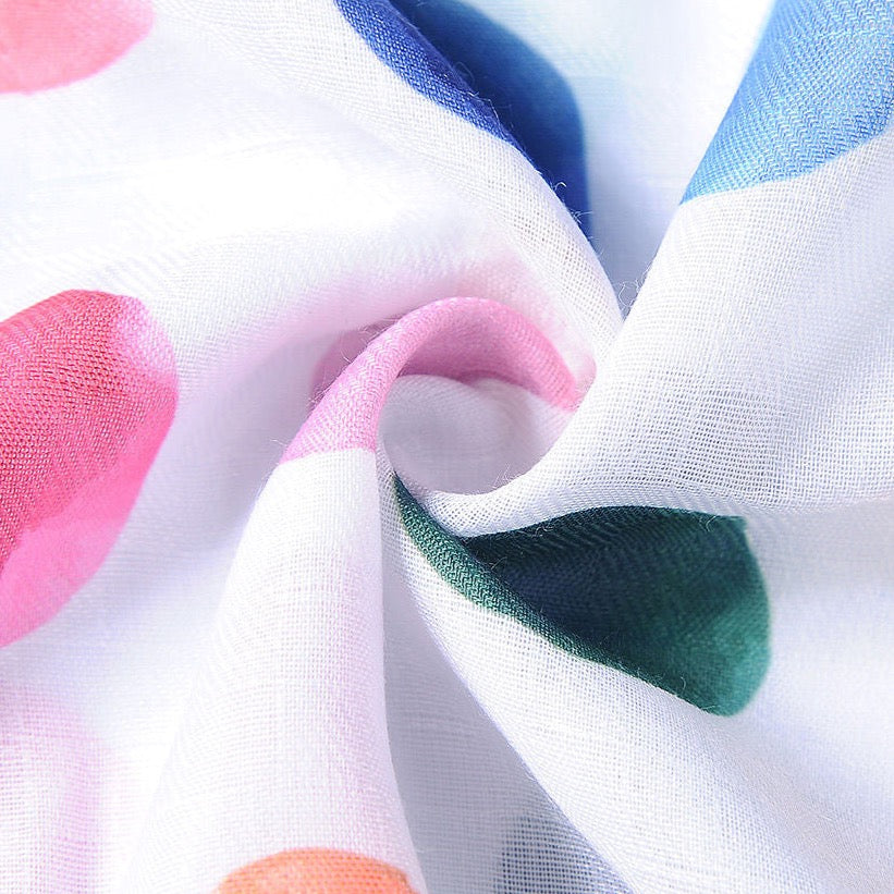Close up of coloured spot on white scarf
