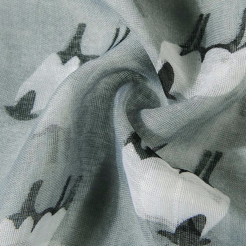 Close up of sheep print scarf in grey