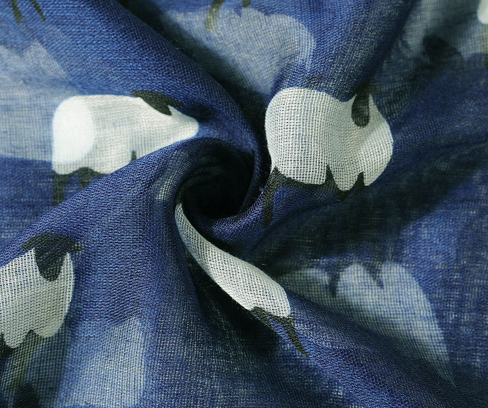 Close up of sheep print scarf in blue
