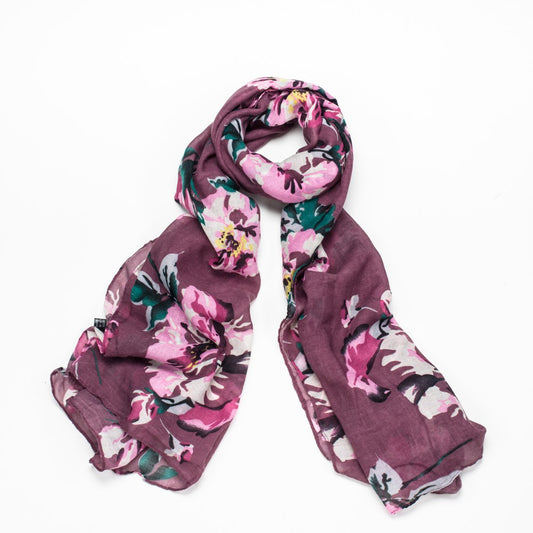 A lovely purple scarf with large pink flower detail and finished with a rolled edge