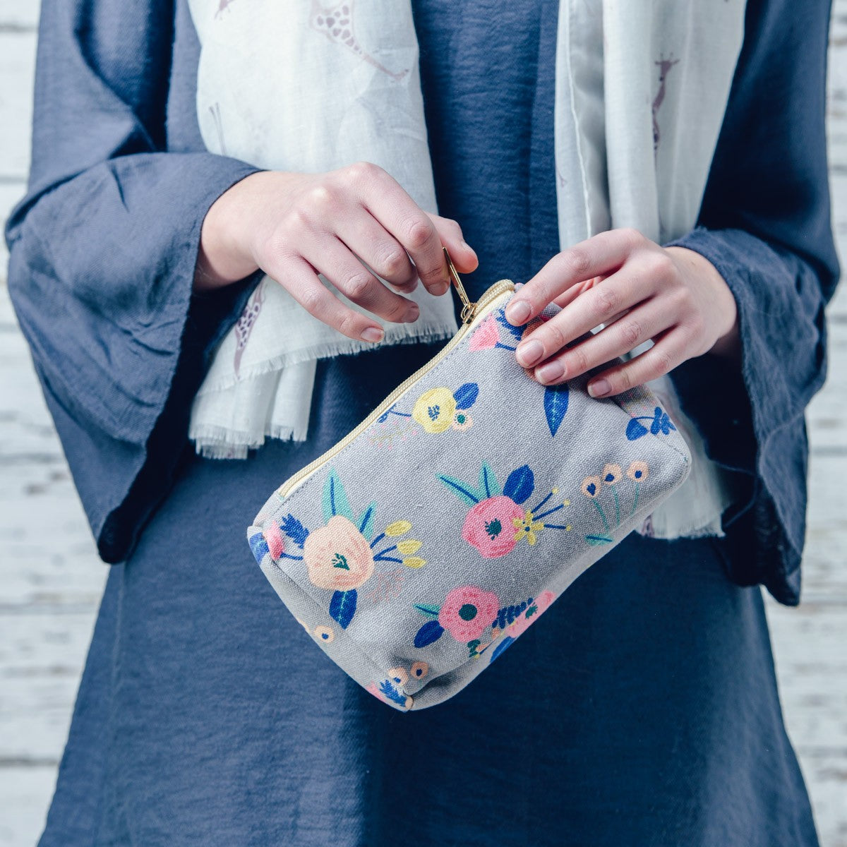 Grey pastel floral print design make up bag.