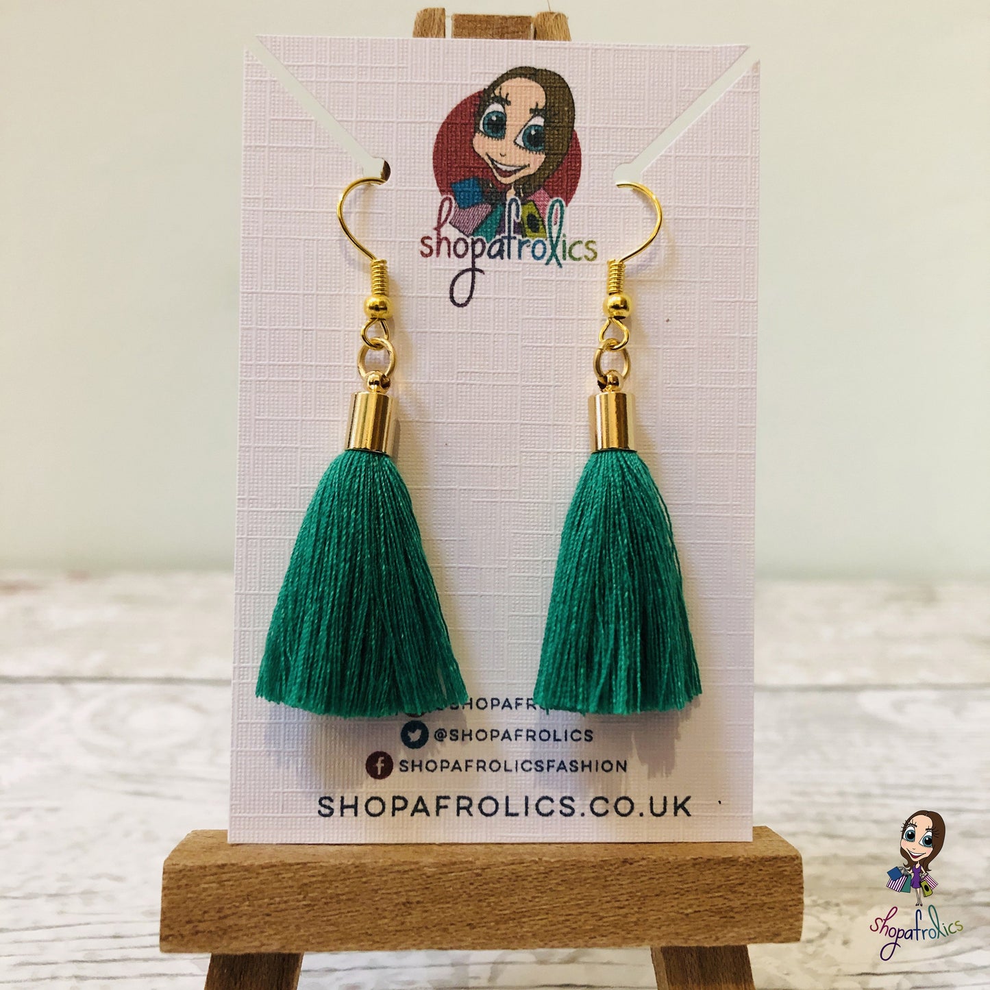 Emerald Green Cotton Tassel Earring with gold plated ear hooks, and findings. on backing card