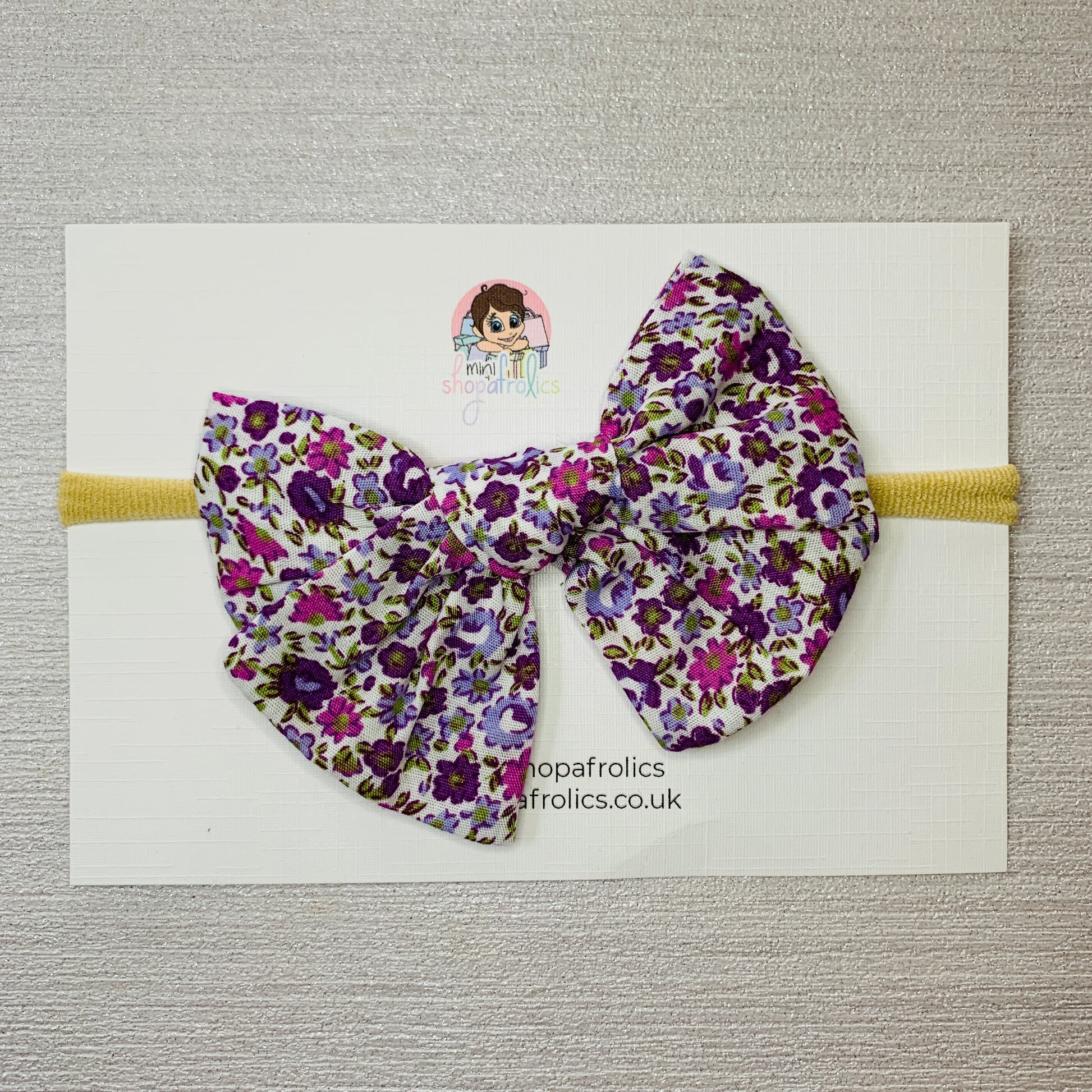 Purple ditsy floral print infant for headband
