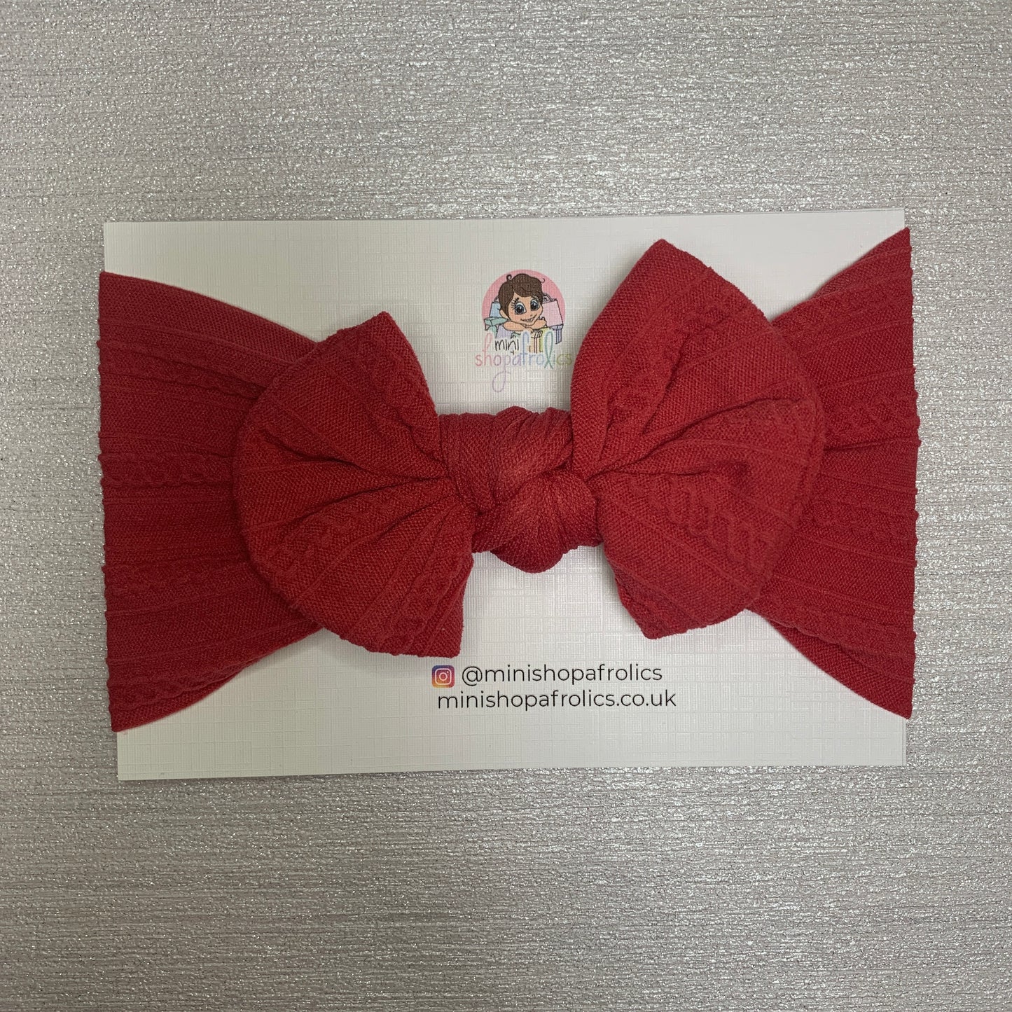 Raspberry hairband on backing card