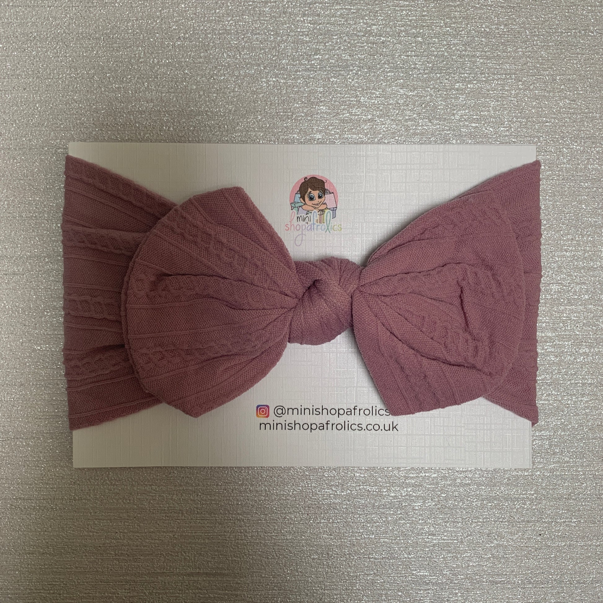 Lavender baby bow headband on backing card
