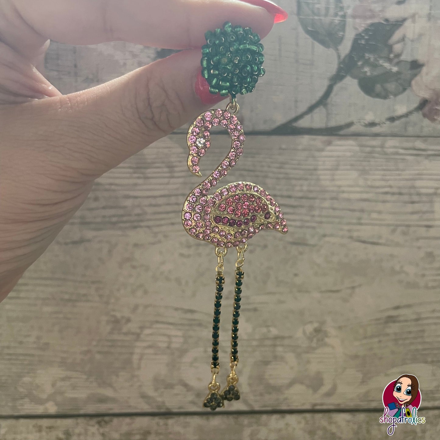 Close up  pink crystal flamingo earrings