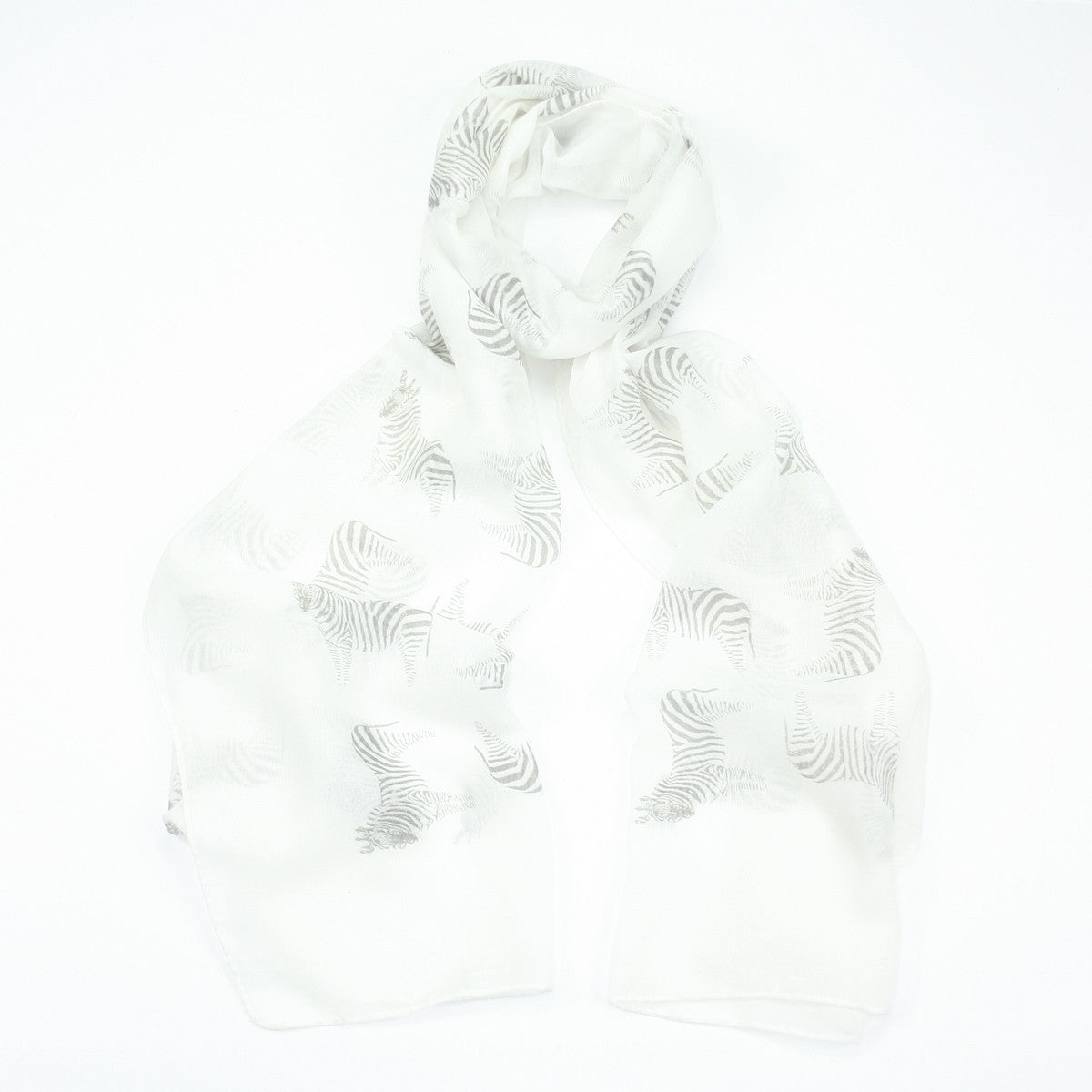 Fun light grey zebra design on a white background printed scarf. 