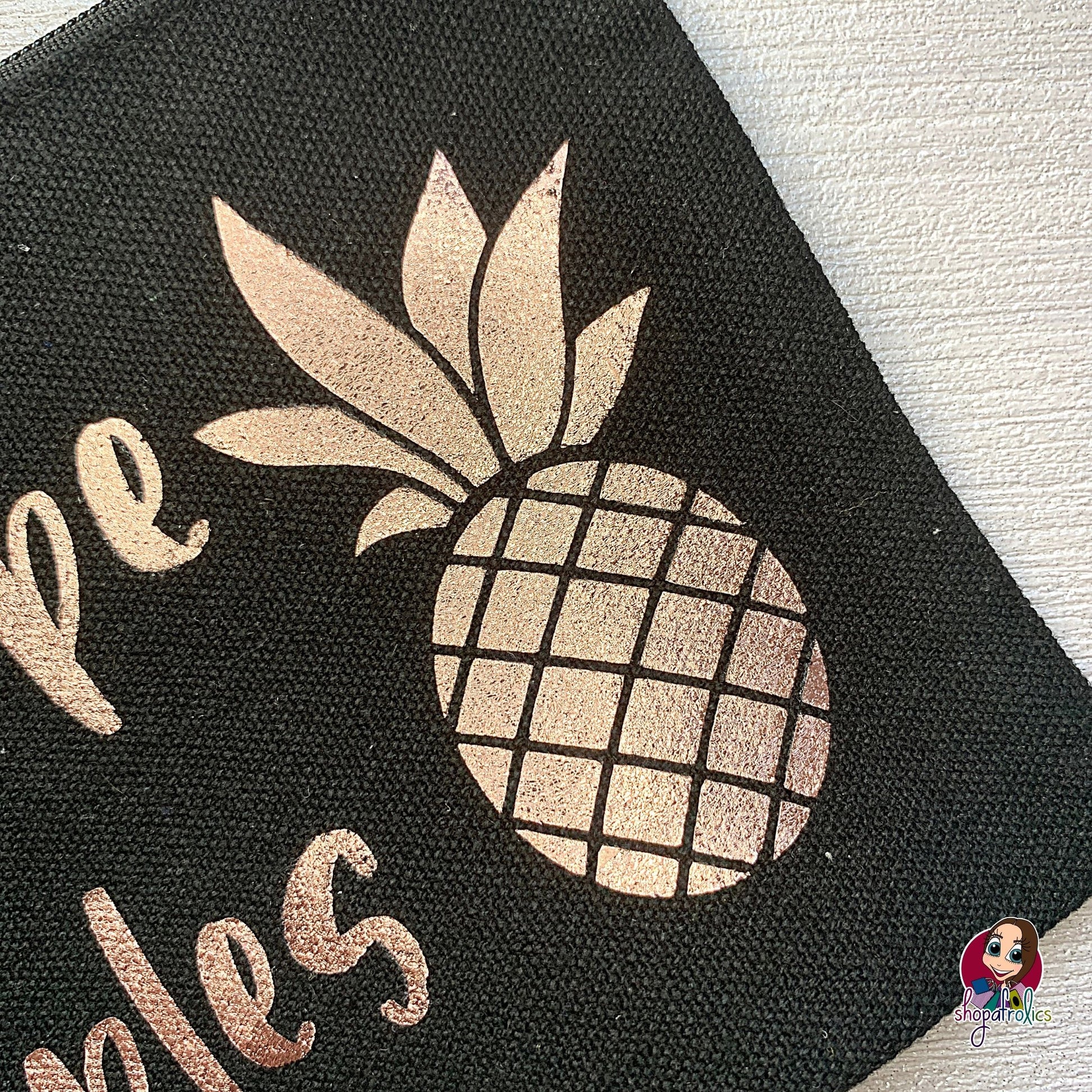 Close up of pineapple on love hope and pineapples make up bag