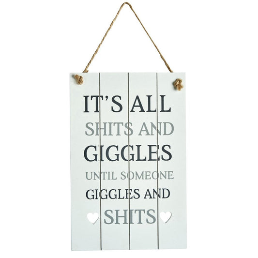 Wooden sign with a vintage chic look and featuring the slogan: It's all shits and giggles until someone giggles and shits. 