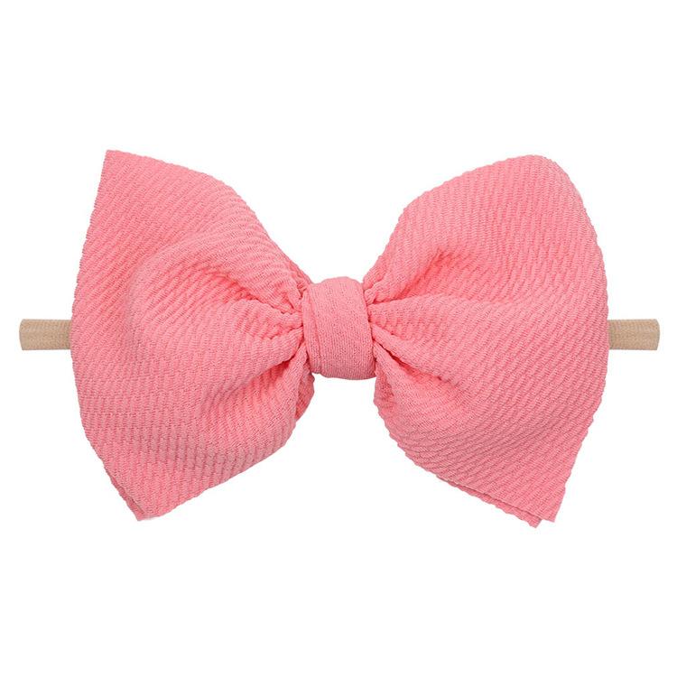 Background removed pink waffle bow baby headband