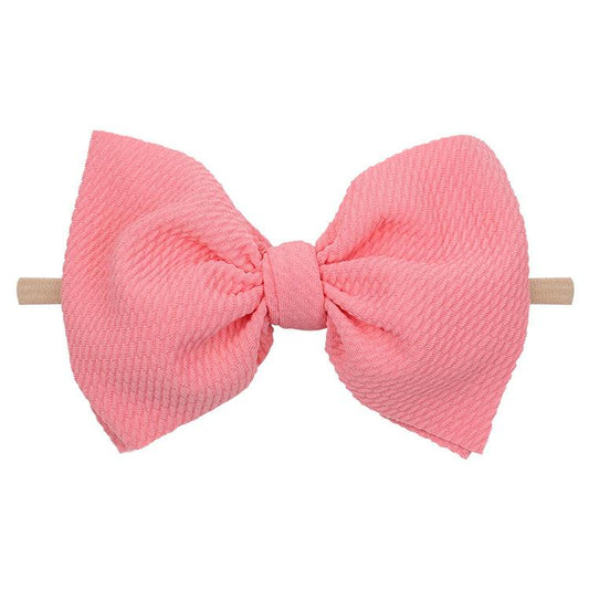 Background removed pink waffle bow baby headband