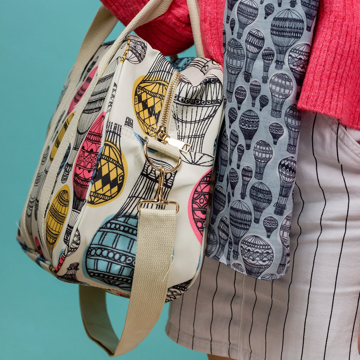Vibrant hot air balloon print weekend bag, on a solid white coloured background.