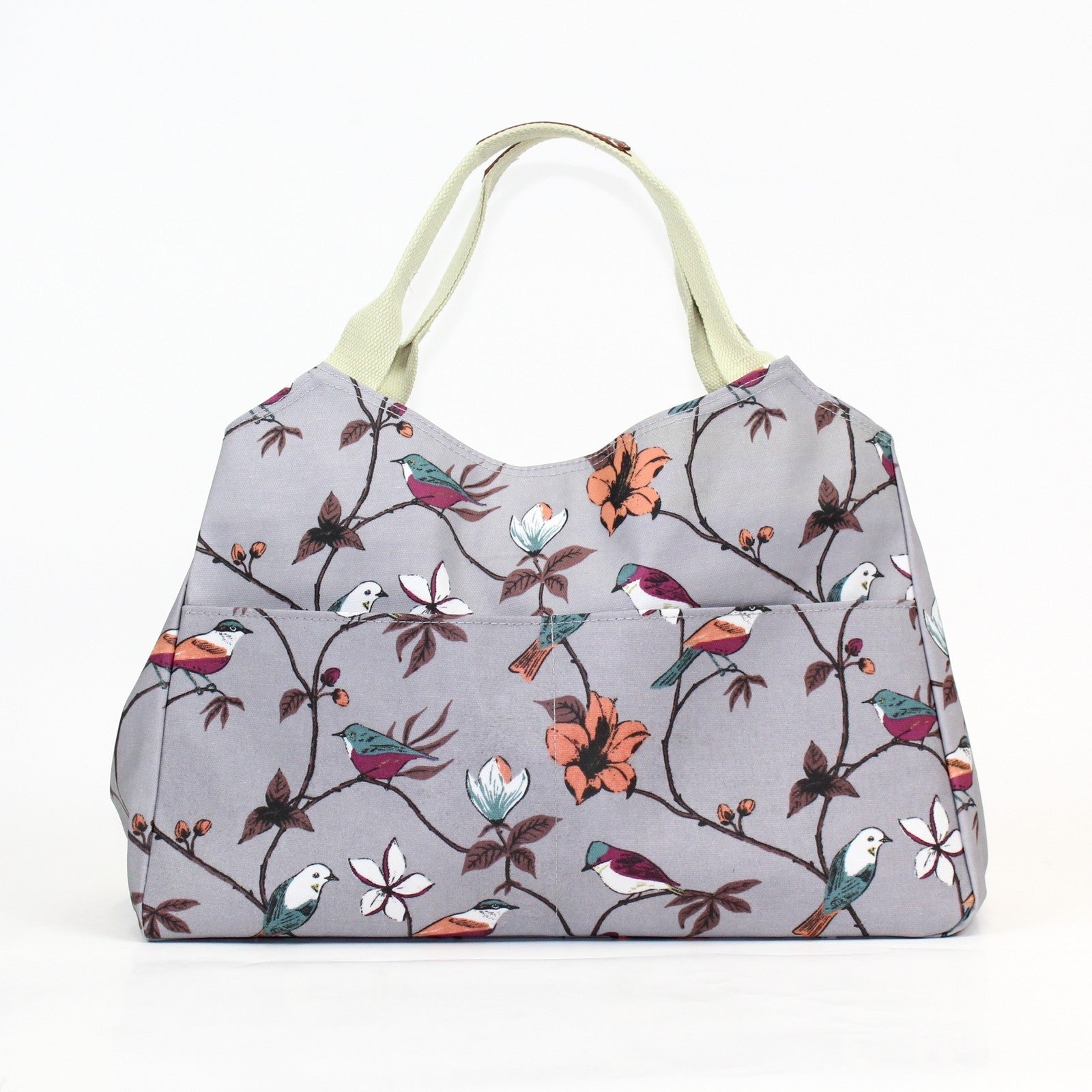 Gorgeous bird and flower print multi-functional day bag on a grey coloured background.