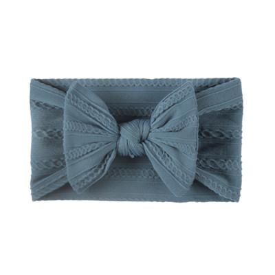 Petrol blue baby headband with bow on cable knit material