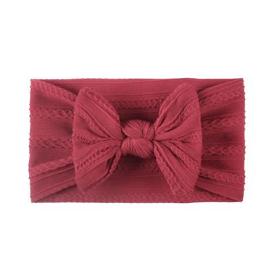 Raspberry baby headband in soft cable knit material