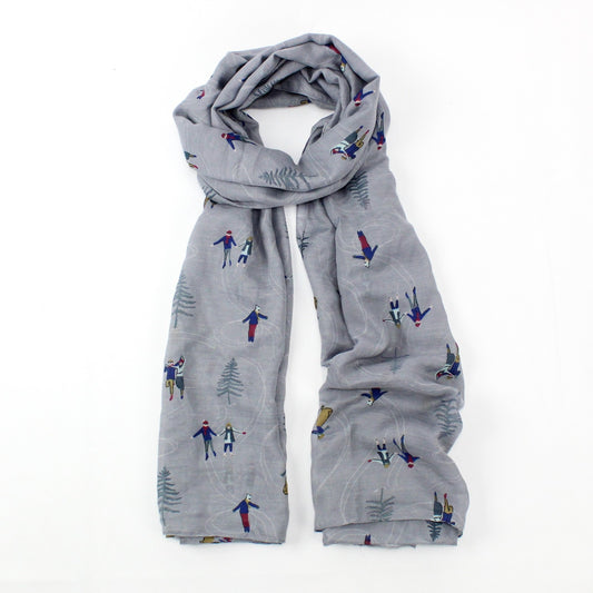 Light grey winter wonderland featuring ice skaters design print, finished with a rolled edge