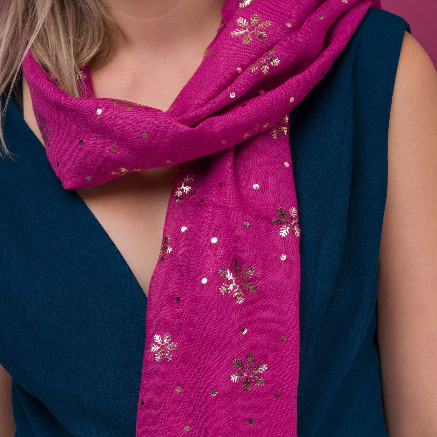 Delicate snowflake foil print pink scarf, finished with a rolled edge.
