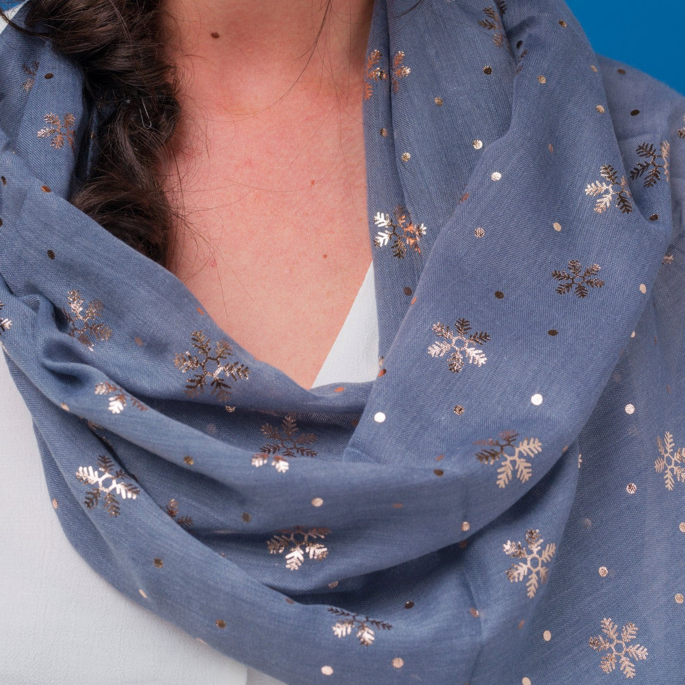 Delicate snowflake foil print grey scarf, finished with a rolled edge.