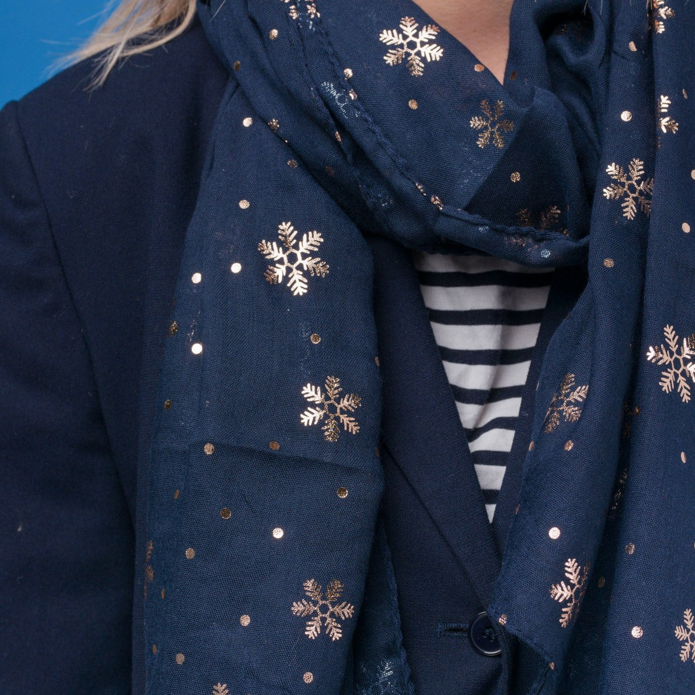 Delicate snowflake foil print navy blue scarf, finished with a rolled edge.